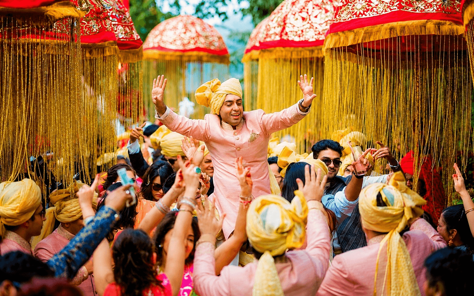 Decorated wedding procession entrance with warm celebration lighting